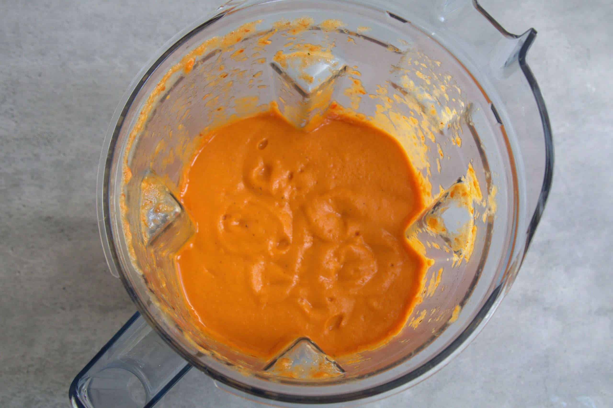 Blended roasted tomato and bell pepper soup in a blender