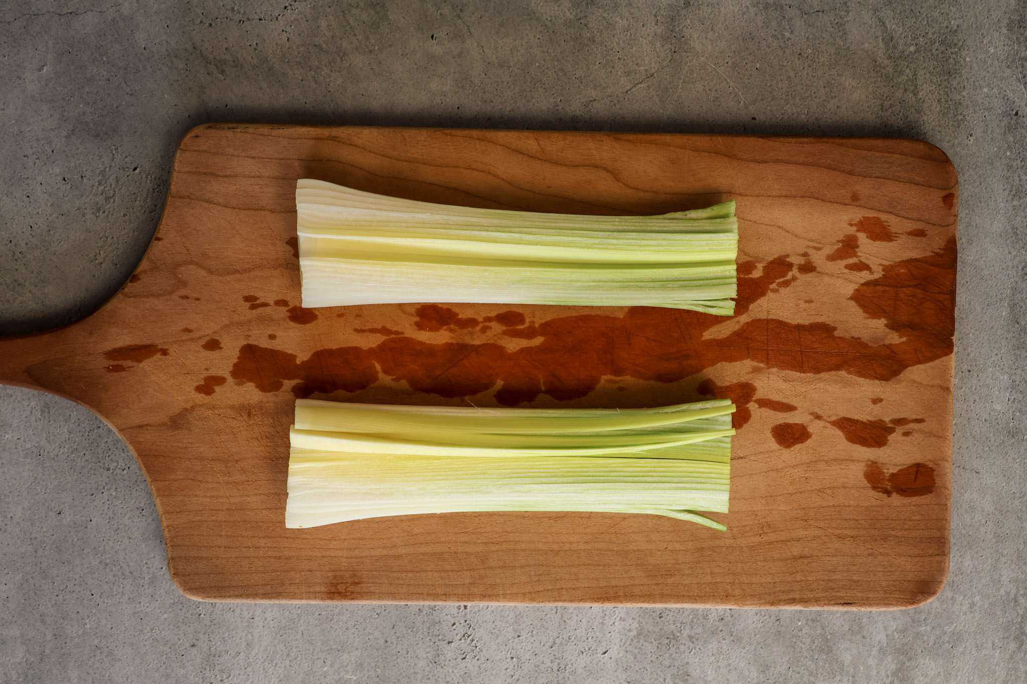 a like sliced in half on a wooden board