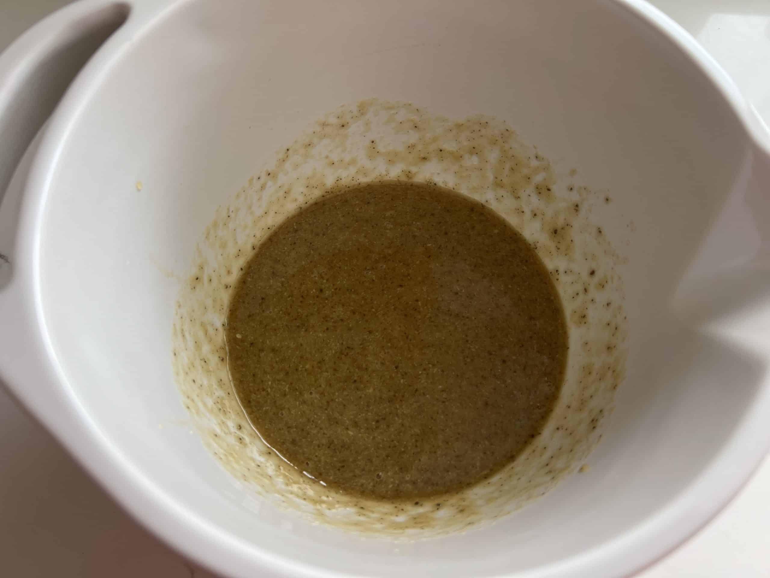 vegan gluten free chocolate chip cookie wet ingredients fully whisked in a bowl