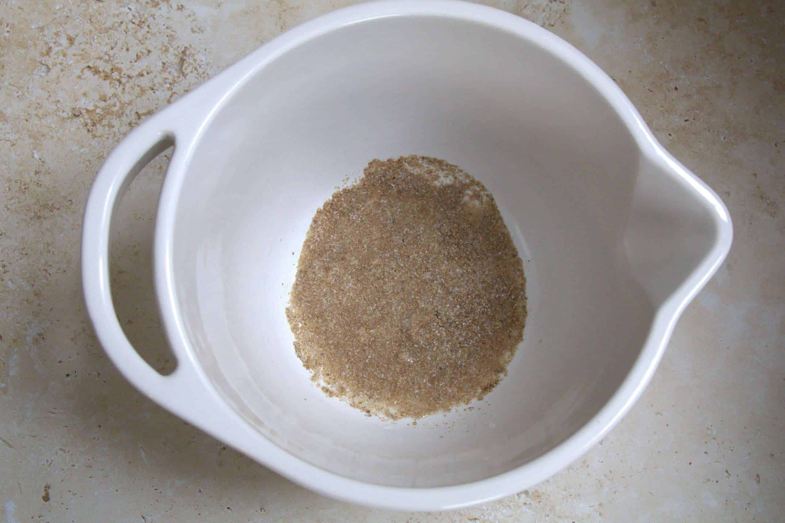 ground white chia soaking with water in a white bowl