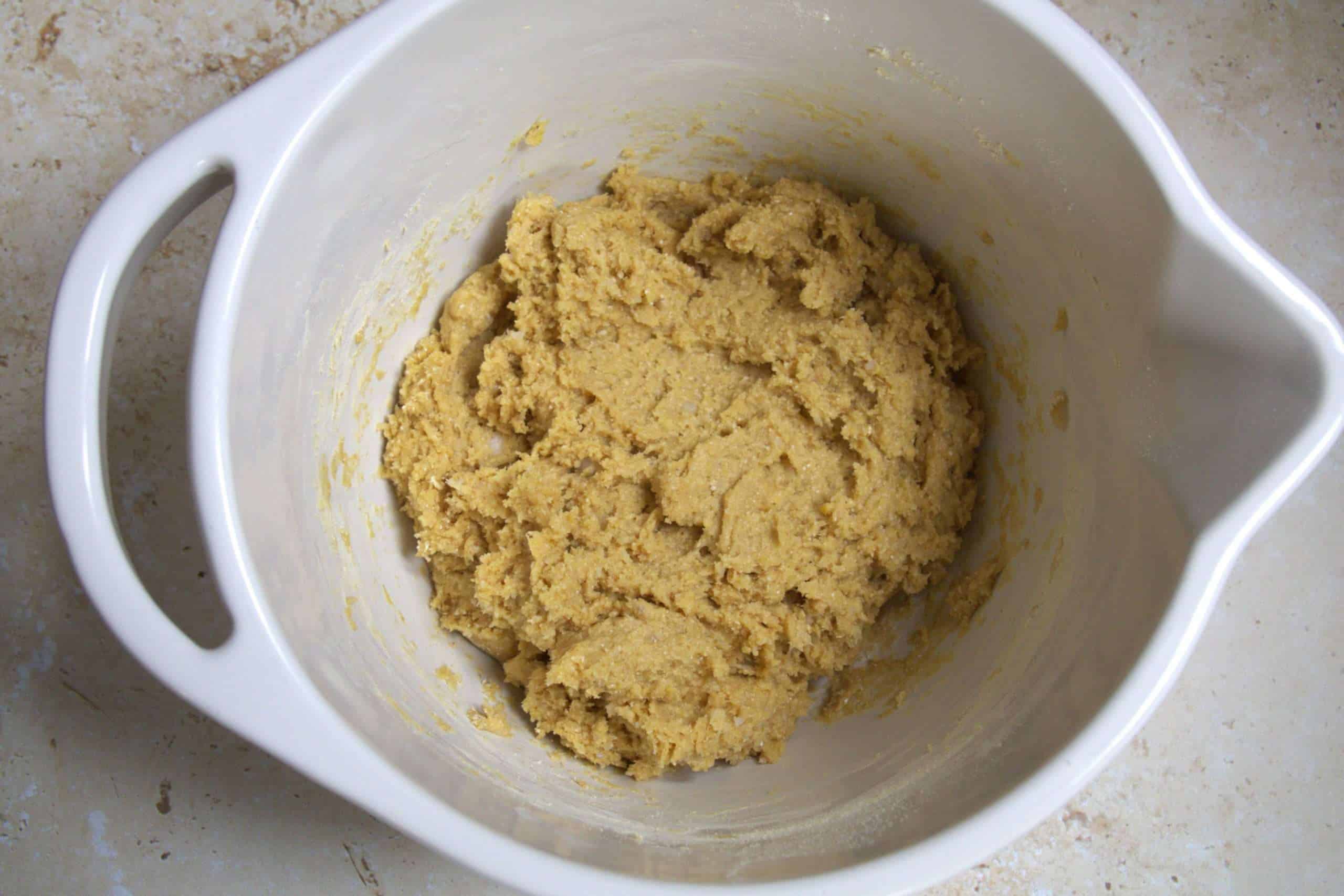 A light colored cookie dough in a mixing bowl