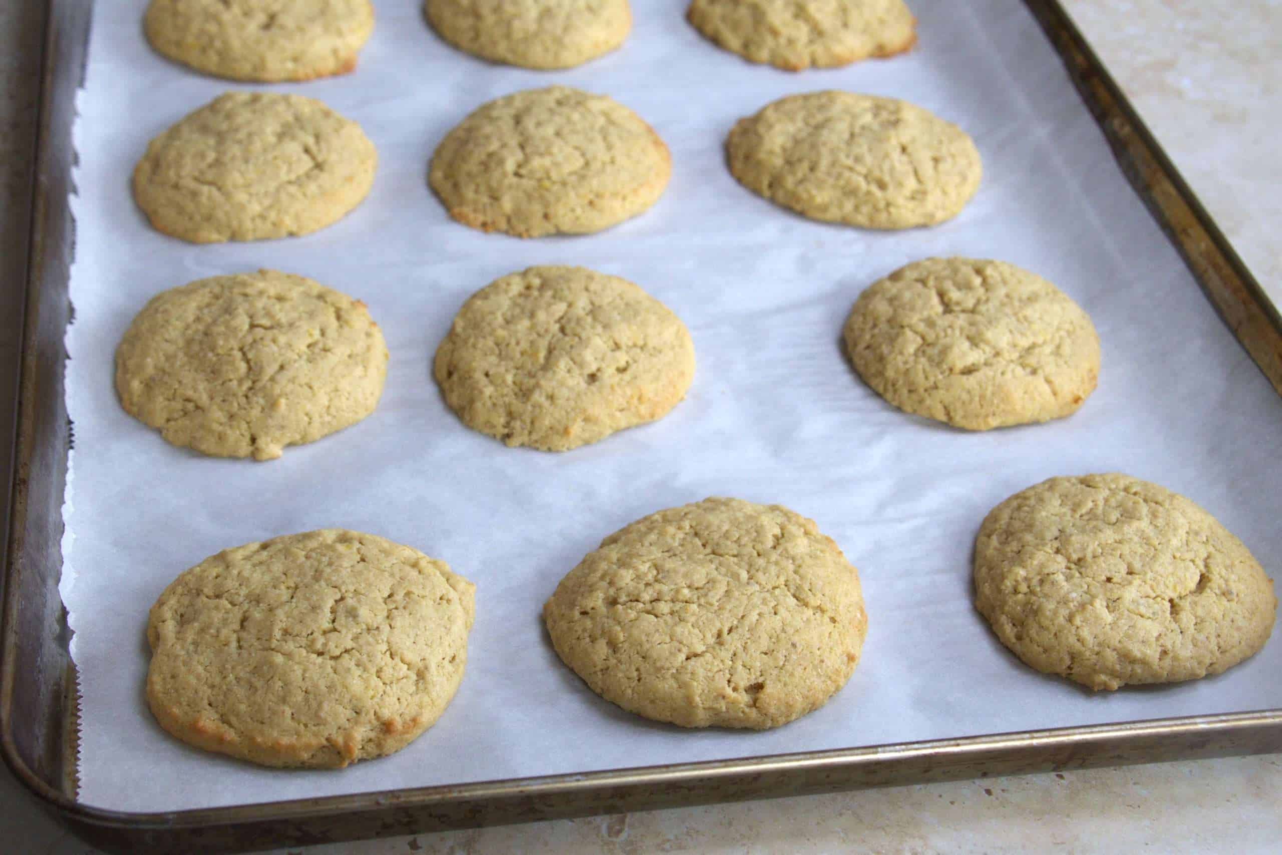 Baked gluten-free lemon cookies on a baking sheet
