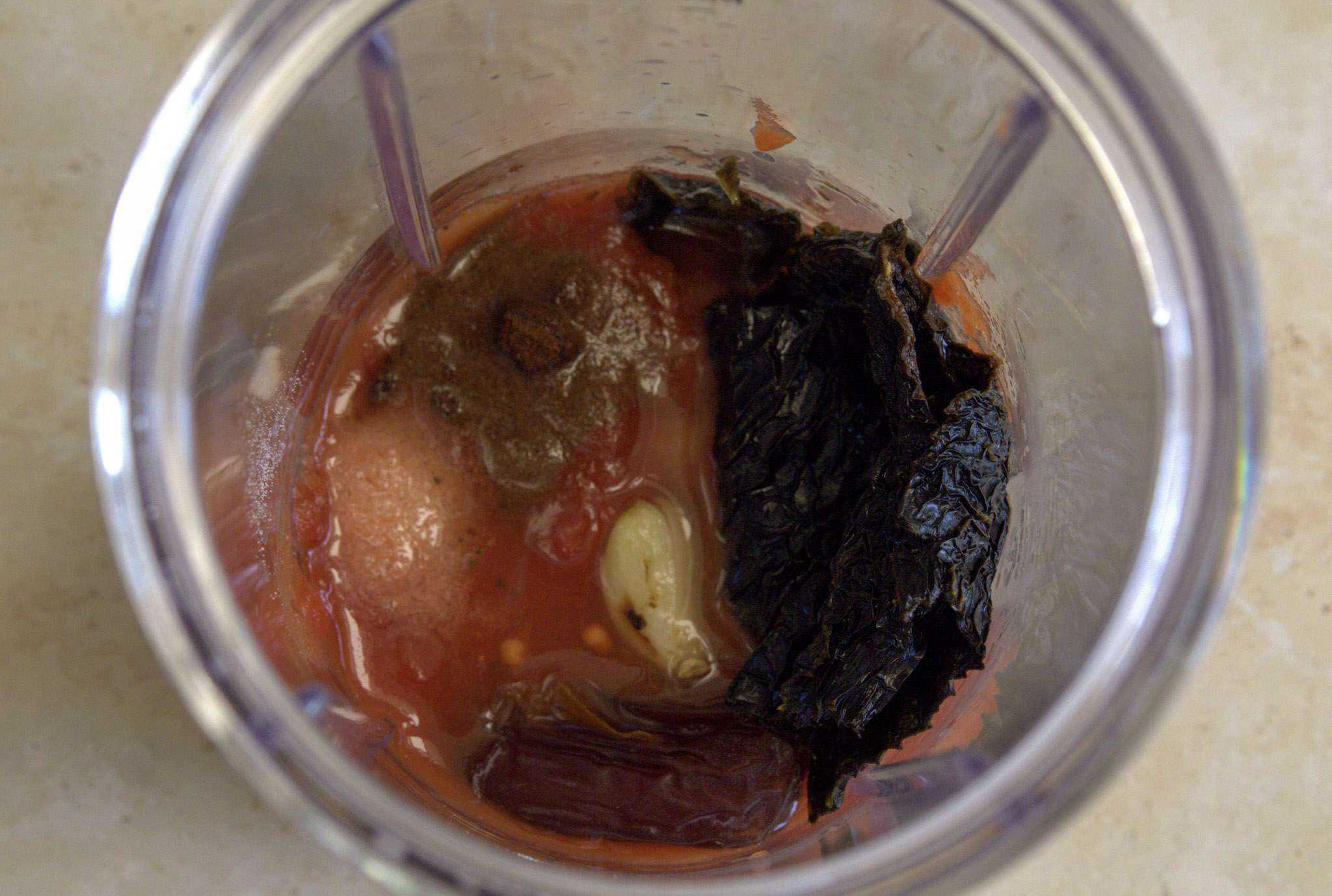 Ingredients for adobo inspired sauce in a blender container ready to be blender