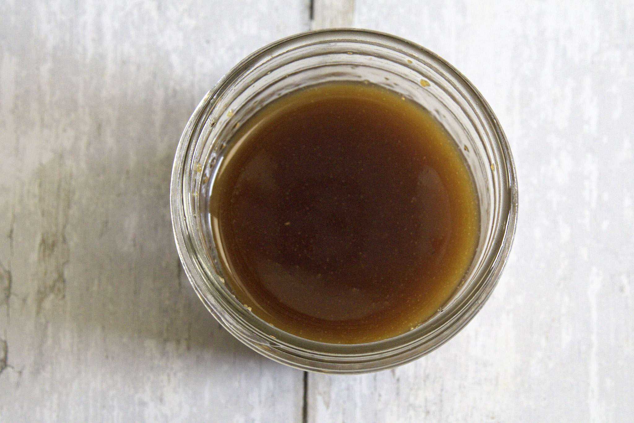 Dressing for strawberry asparagus salad blended in a glass jar