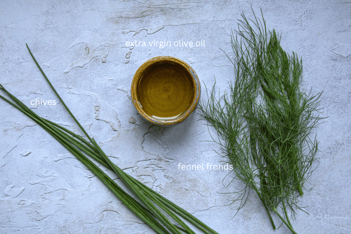 Fennel fronds, chives and a small bowl of extra virgin olive oil