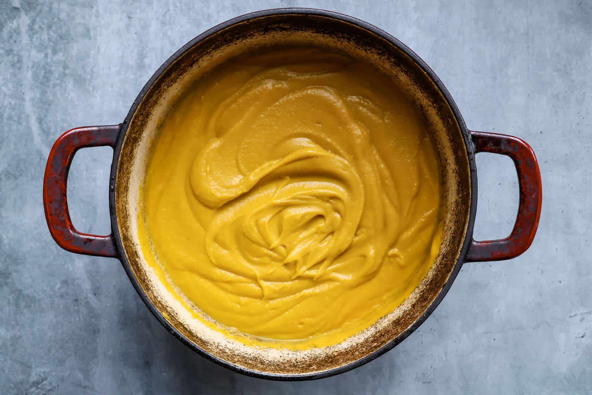 a pot with pureed creamy winter vegetable soup