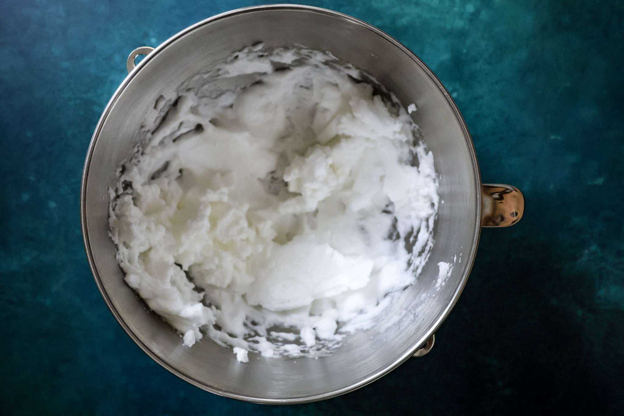A mixer bowl with whipped egg whites
