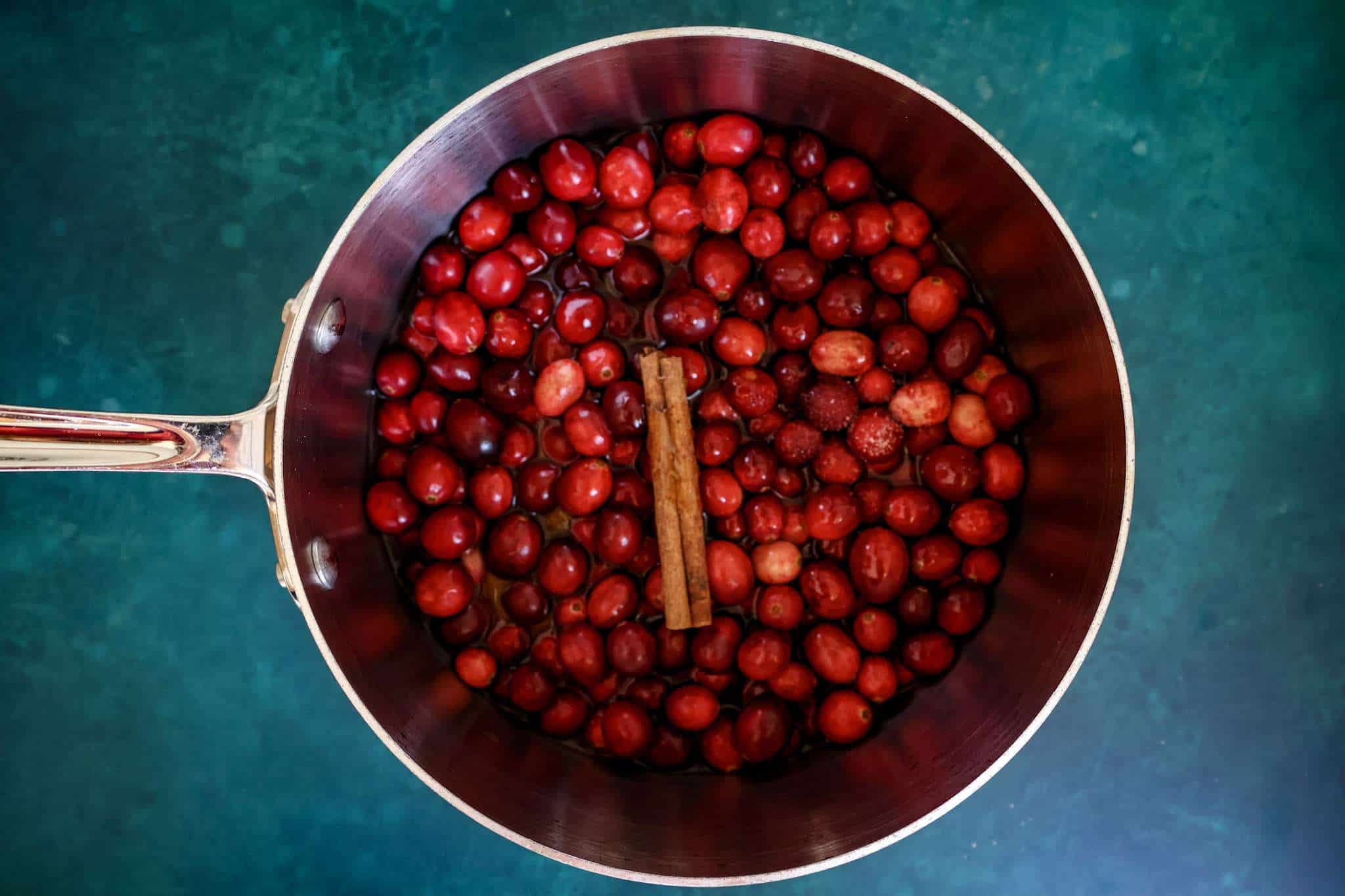 cranberry sauce ingredients for gluten-free cranberry orange tiramisu pie in a small pot
