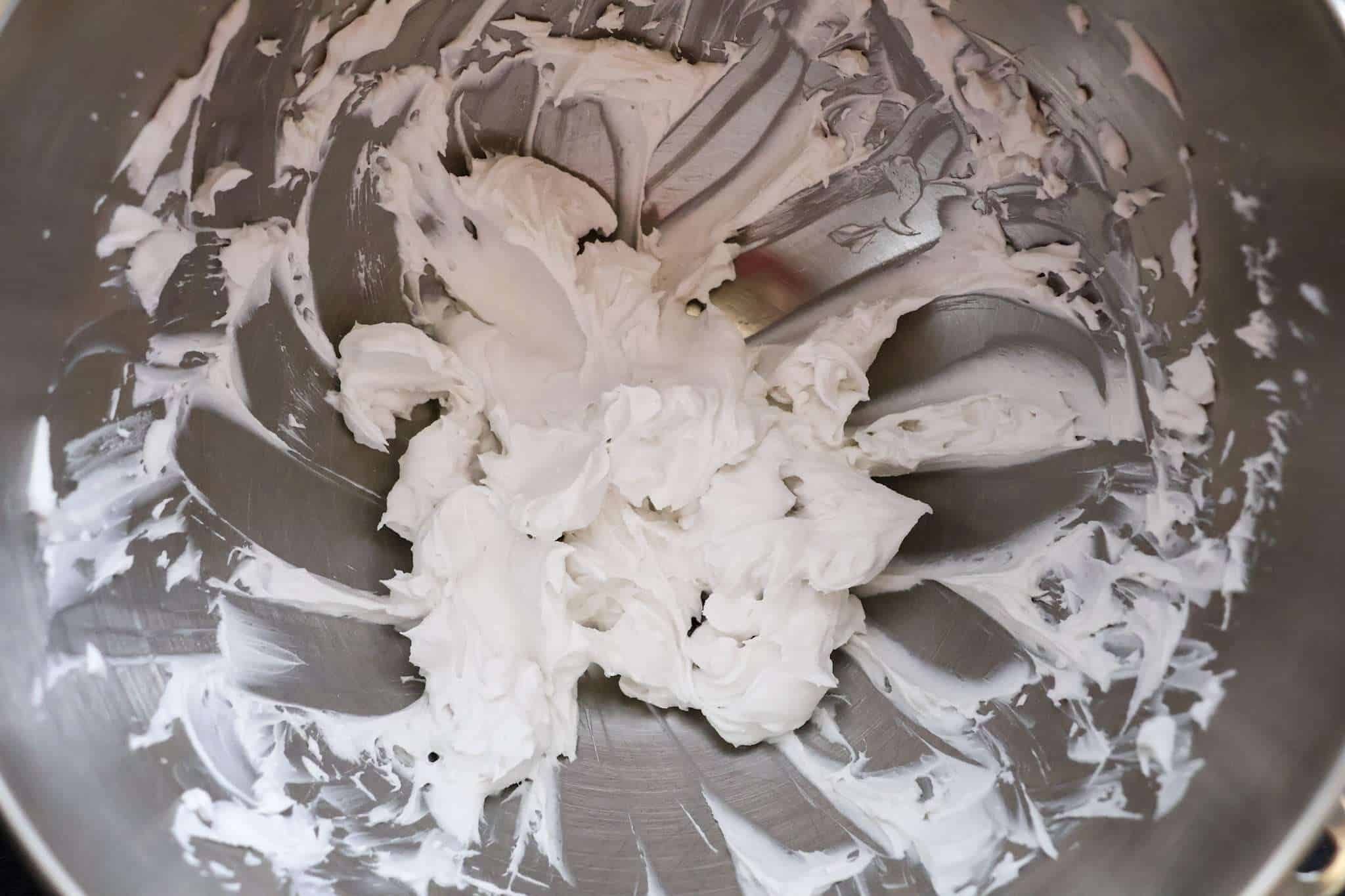 whipped coconut cream in a mixer bowl