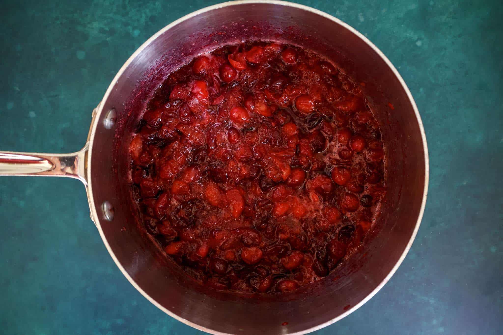 cooked cranberry sauce in a small pot