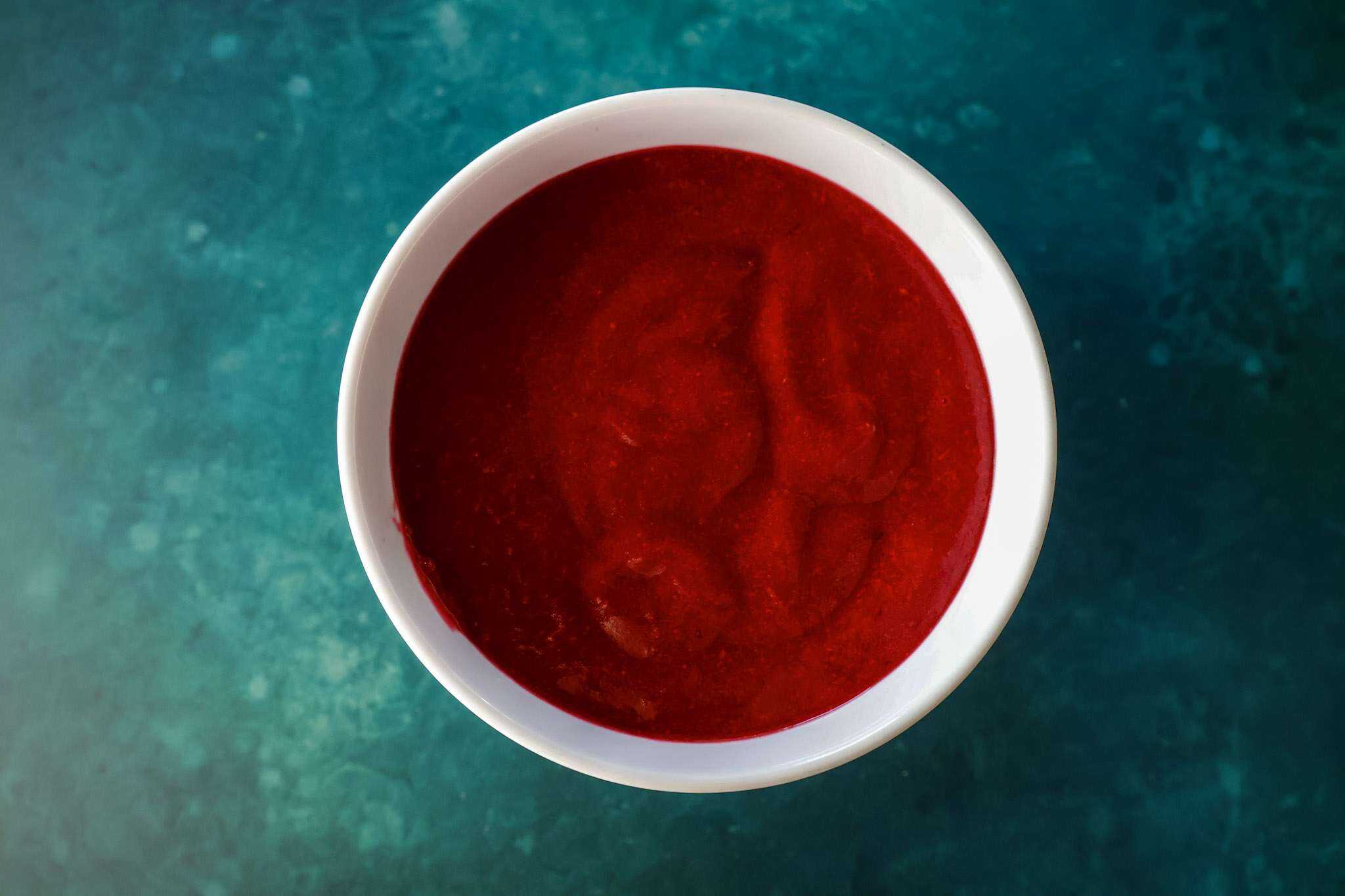 pureed cranberry sauce in a white bowl