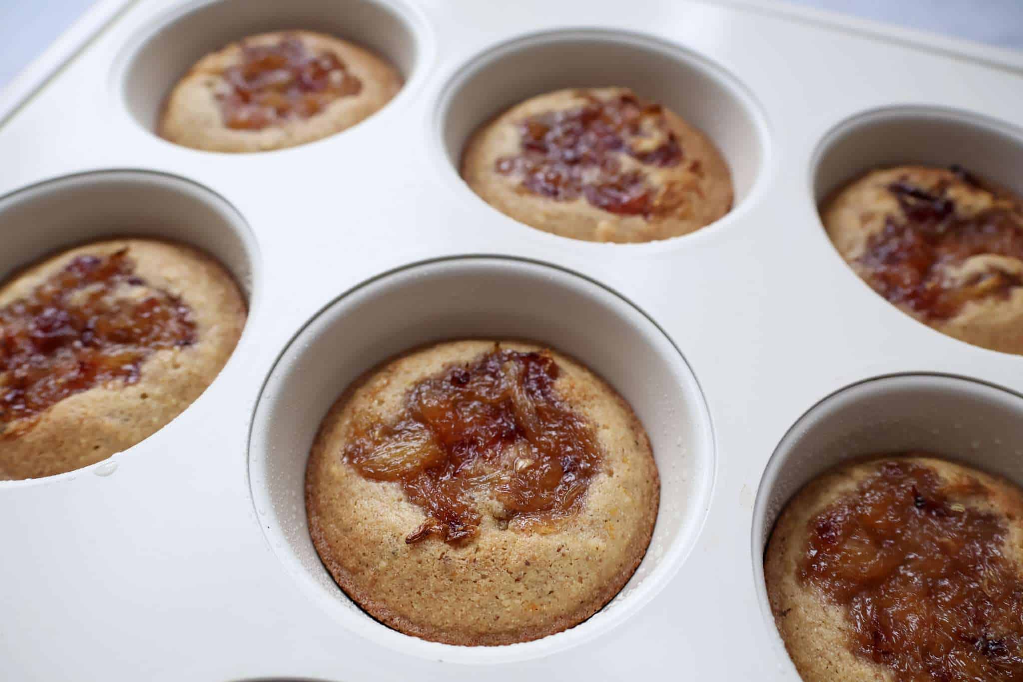 Baked orange walnut frangipane style cakes in muffin tin