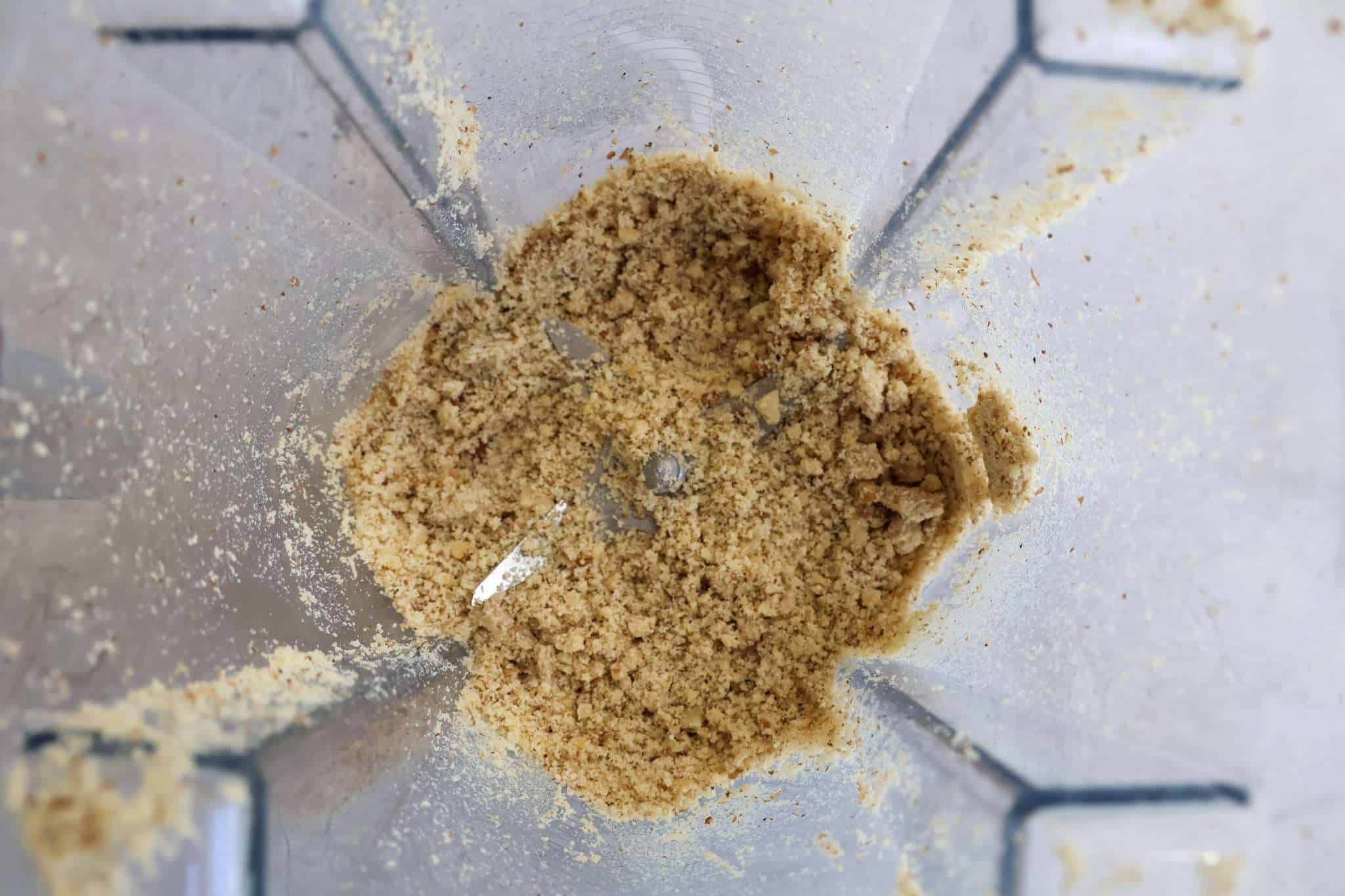 Ground walnuts inside a blender