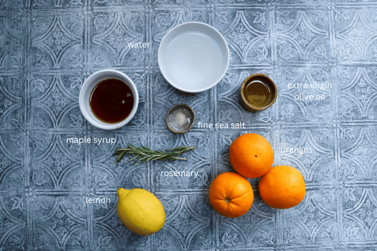 All ingredients for citrus olive oil granita with rosemary are displayed and labeled