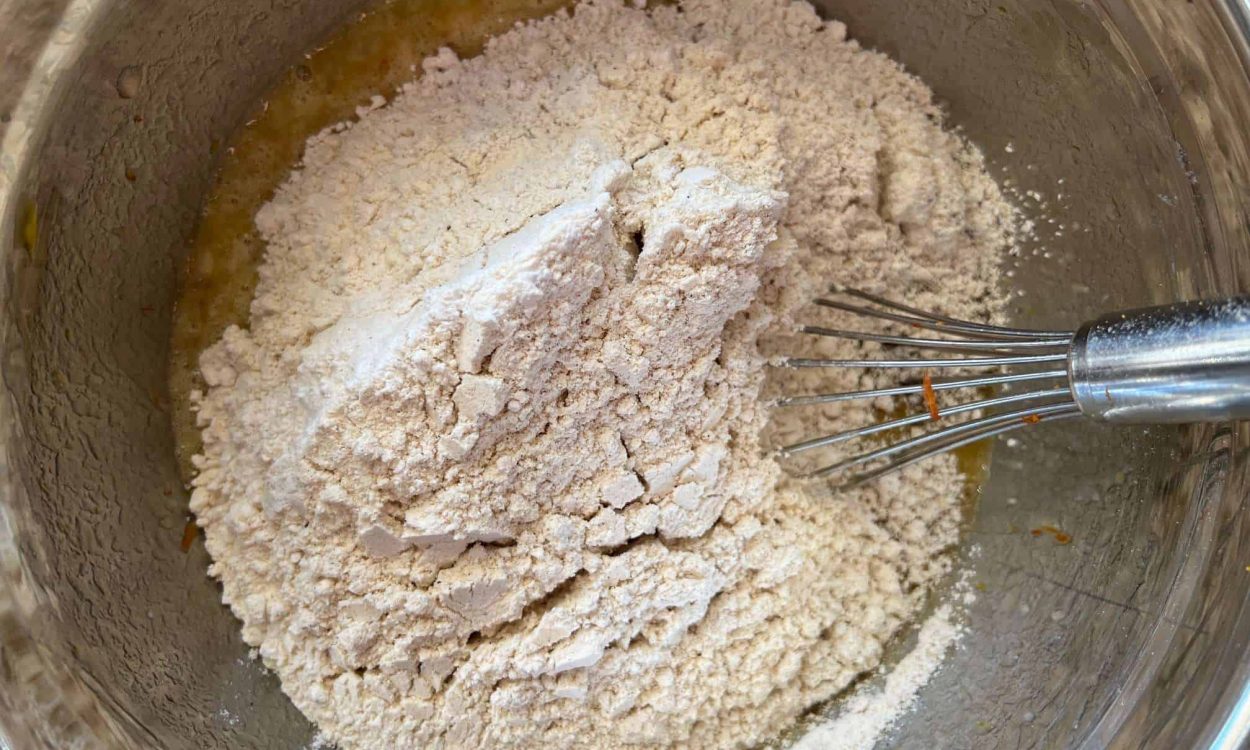 dry ingredients added to wet ingredients for banana cardamom muffins