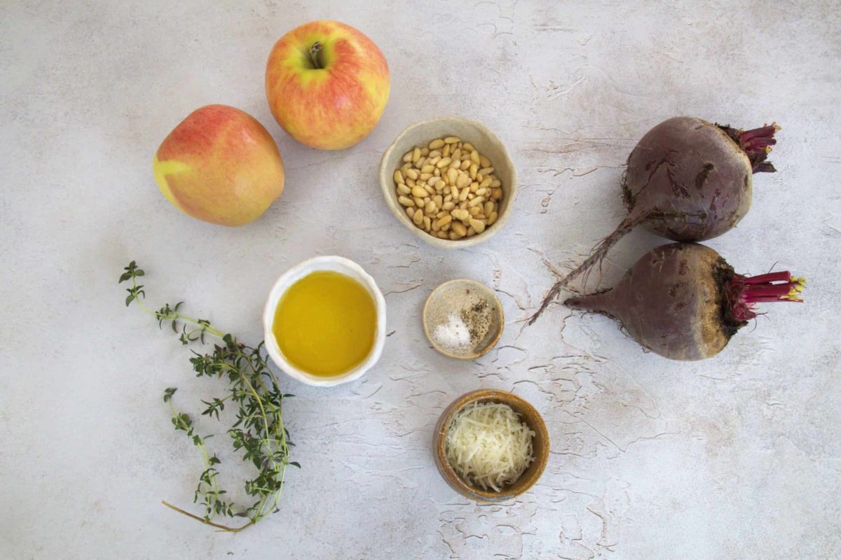 ingredients for beet and apple carpaccio, including apples, beets, pine nuts, olive oil, grated pecorino romano, thyme and salt and pepper