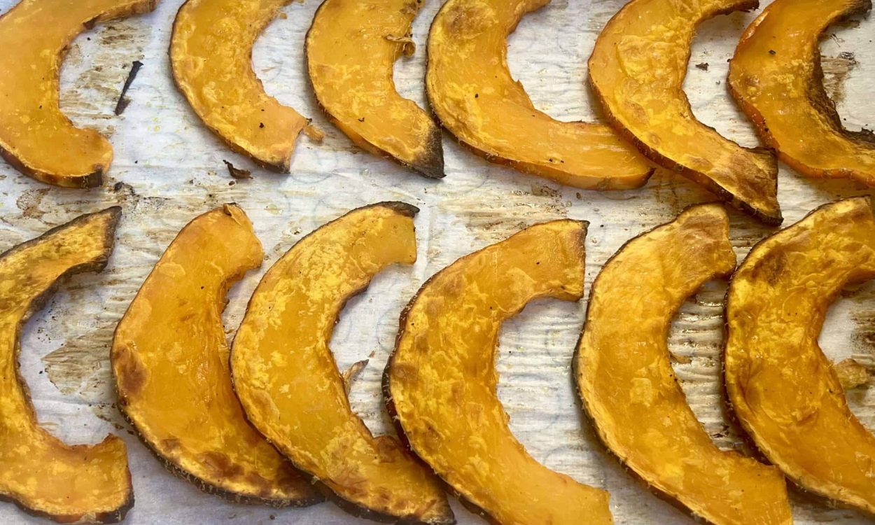 roasted north georgia candy roaster roasted winter squash slices on a baking sheet